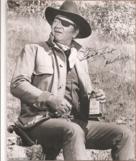 John Wayne - True Grit sitting with bottle 8x10